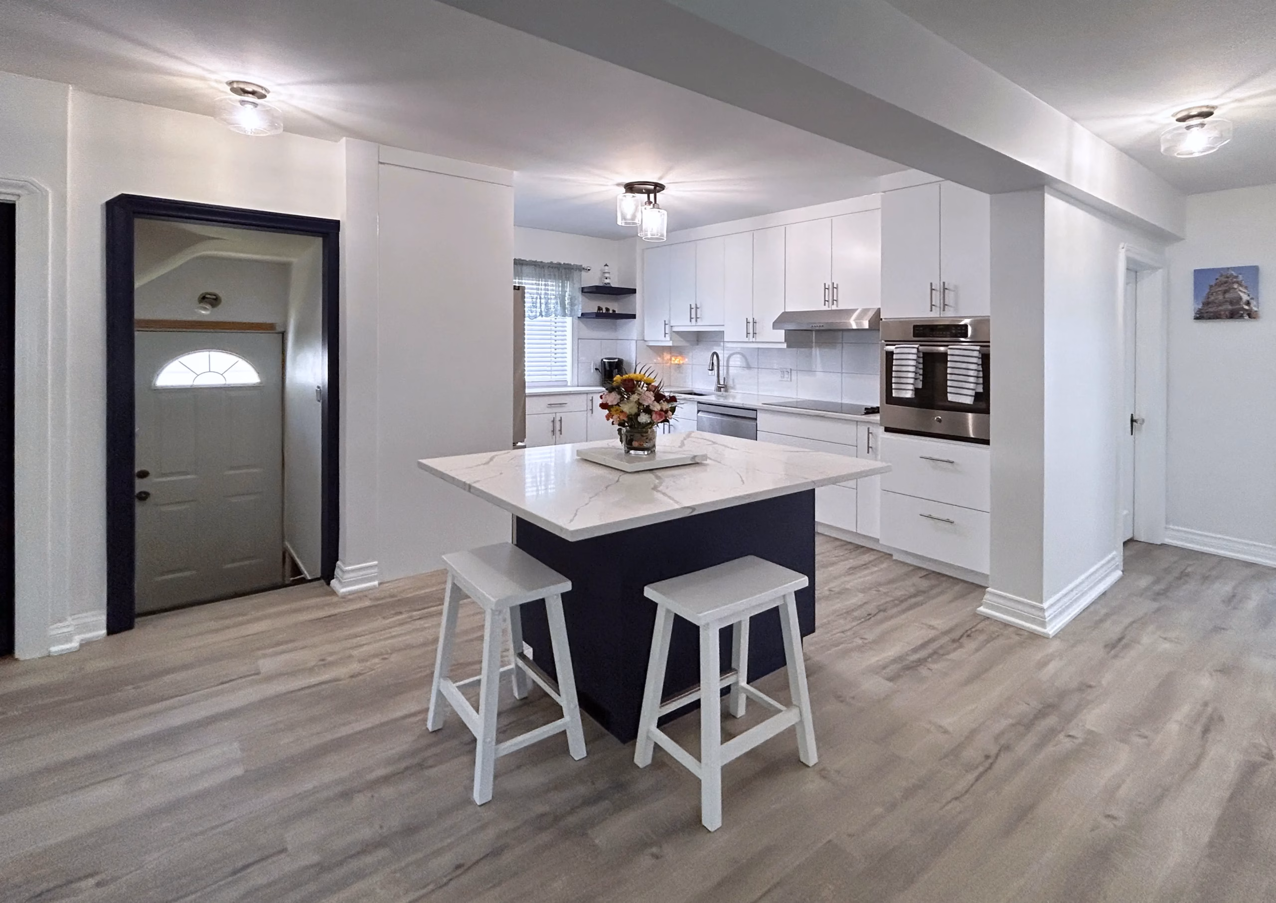 Kitchen with a dark blue island