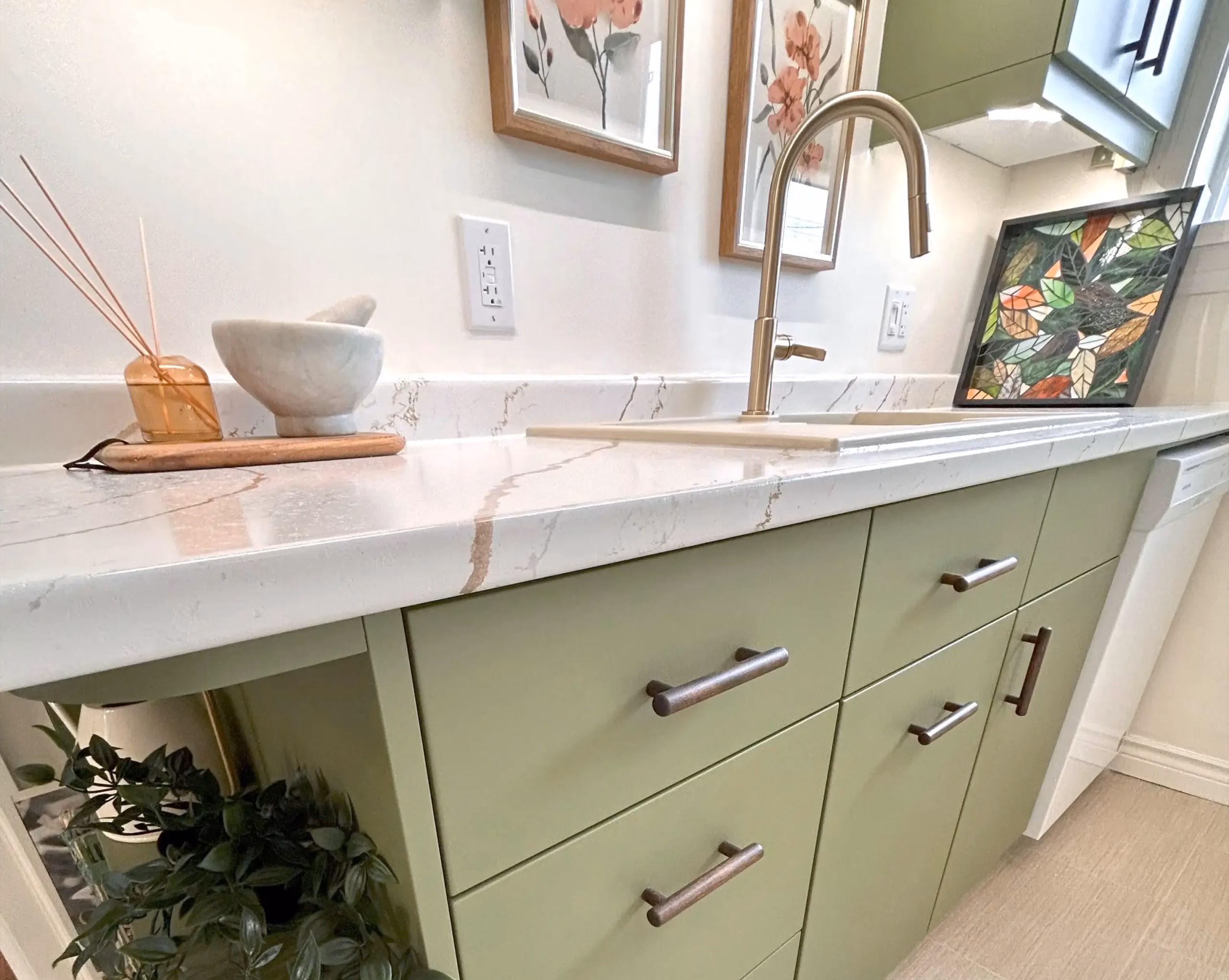 Close-up of green kitchen cabinets