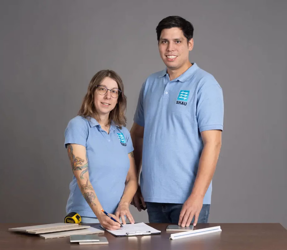 Stephen and Amanda reviewing plans at a desk